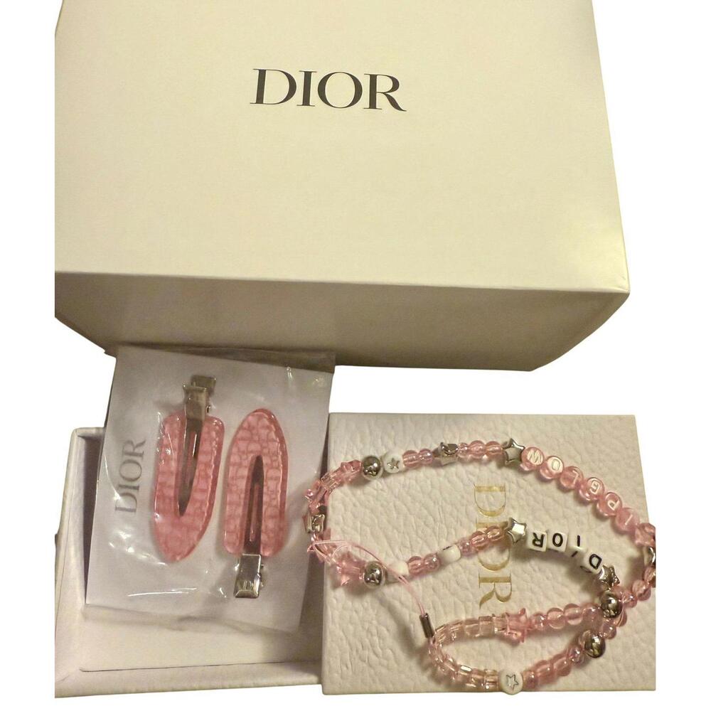 Dior phone charm and hair clips. GWP